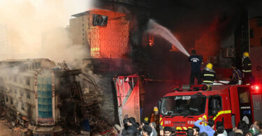 Smoke and debris after Gul Plaza fire highlighting environmental pollution in Karachi
