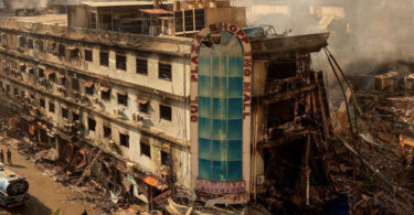 Gul Plaza Karachi fire aftermath showing burnt commercial building and rescue operations