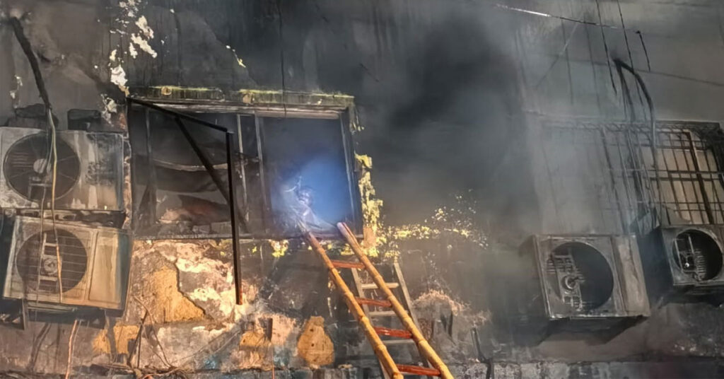 Gul Plaza Karachi fire aftermath showing burnt commercial building and rescue operations