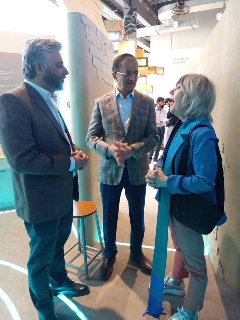 Visitors exploring the Lost Cities of the Indus Delta exhibition showcasing ancient maritime civilizations in Karachi.