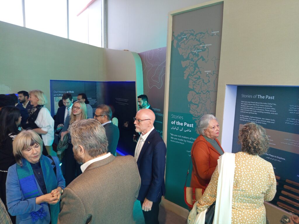 Visitors exploring the Lost Cities of the Indus Delta exhibition showcasing ancient maritime civilizations in Karachi.