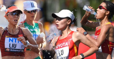 Female marathon runners pouring water over themselves during a race in extreme heat conditions.