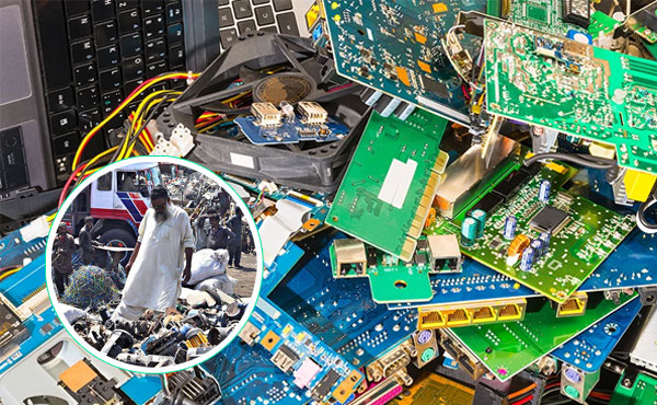 Close-up view of discarded circuit boards, cables, and computer components layered together as electronic waste.