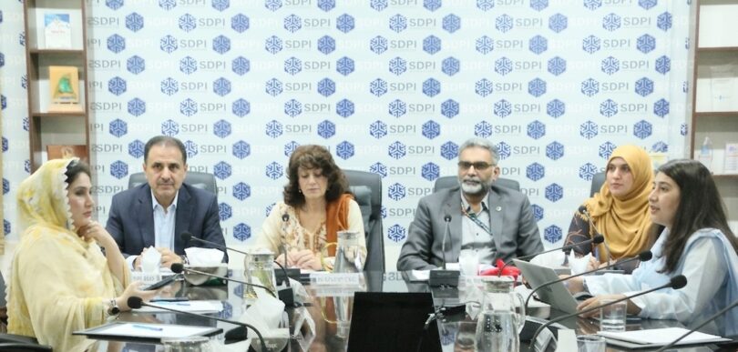 Experts and officials attending a meeting at SDPI Islamabad discussing glacier melting and climate risks