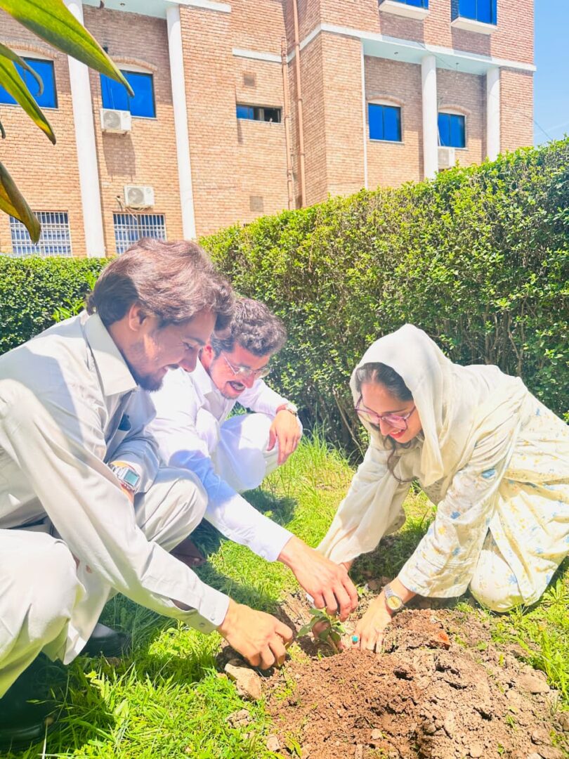 Students participating in a tree plantation drive on Earth Day 2026